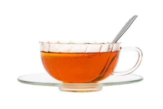 glass cup with tea and a lemon on a white background