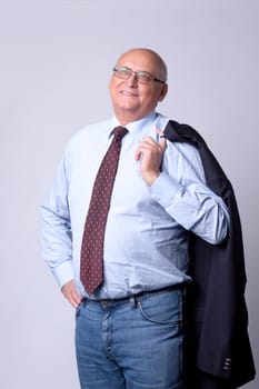 portrait of a successful senior man on gray background