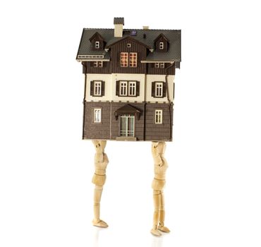 wooden puppets moving the house