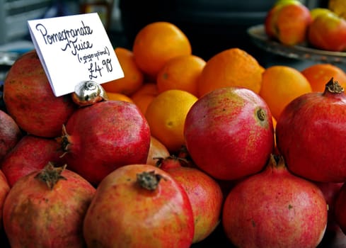 Pomegranate and other types of fruit presented at market