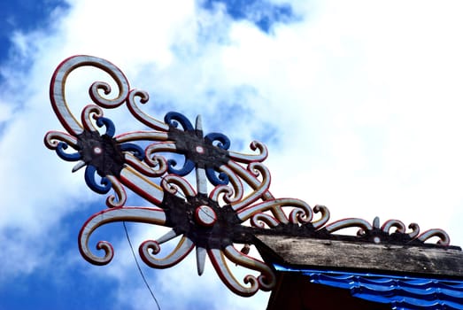 borneo traditional tribal carvings on the roof top of buildings