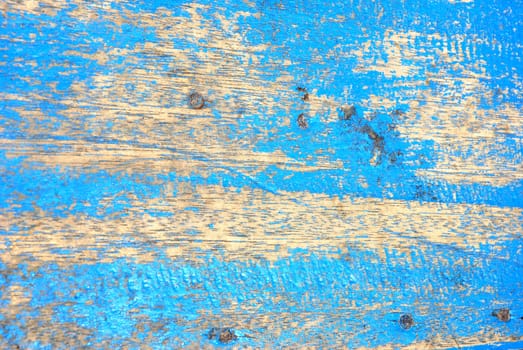 blue wooden boards with paint that was peeling and faded