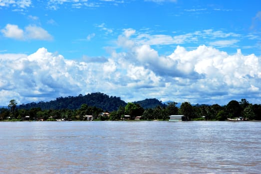 view of a village on the banks of the river Malinau, Indonesia