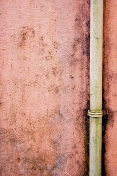 worn painted concrete walls with pipe