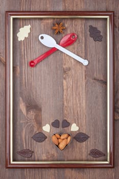 Culinary frame as the coat of arms on a wooden background