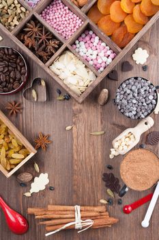 Wooden board with prepared to sweet chocolate baking ingredients