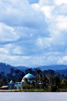 a small mosque on the banks of the river Malinau, Indonesia