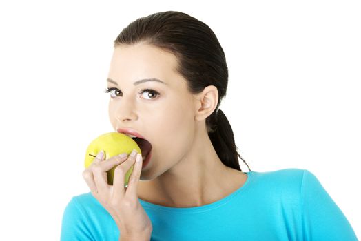 Young woman holding green fresh apple, isolated over white background