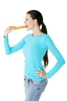 Fit young beautiful woman with carrot, isolated on white