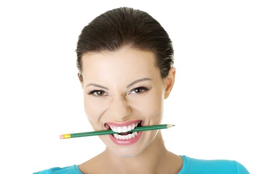 Thoughtful woman with pencil, isolated on white