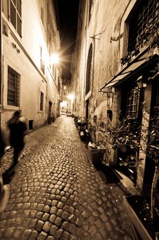 A dark and narrow alley in Rome, Italy