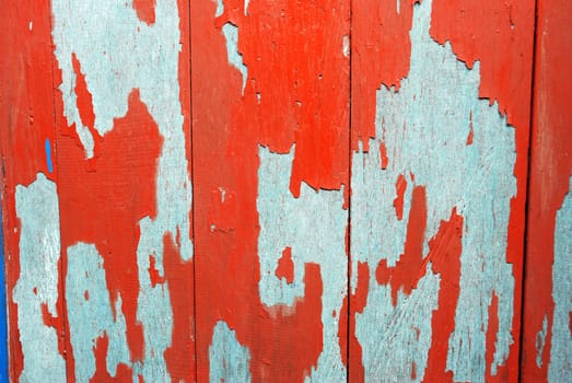 detailed of  texture and pattern at old wooden boards with paint that was peeling and faded