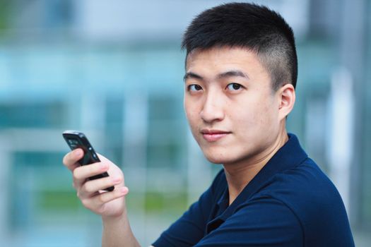 Man typing message on phone