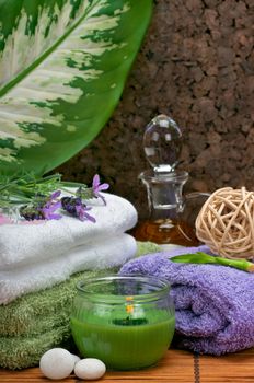 Spa concept with lavender, candle, pebble, massage oil