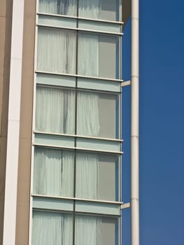 Glasses cladding facade of modern architecture as background