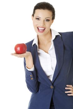 Attractive smiling businesswoman holding red apple, isolated on white