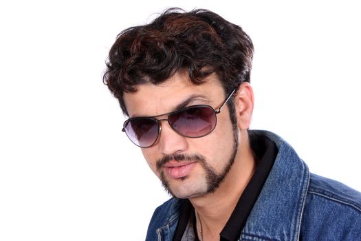 A portrait of a handsome Indian guy, on white studio background.