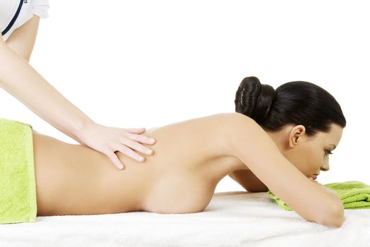 Preaty young woman relaxing heaving massage therapy in spa saloon