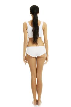 Rear view of taned fit woman in underwear. Diet, healthy lifestyle and body care concept.