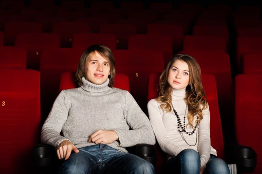 young couple in the cinema to enjoy the movie