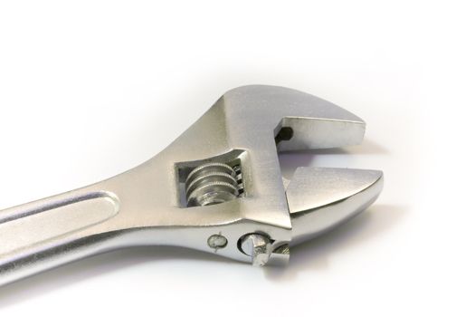 metal adjustable spanner photographed on a white background