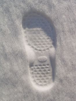 Fresh footprint in new white snow
