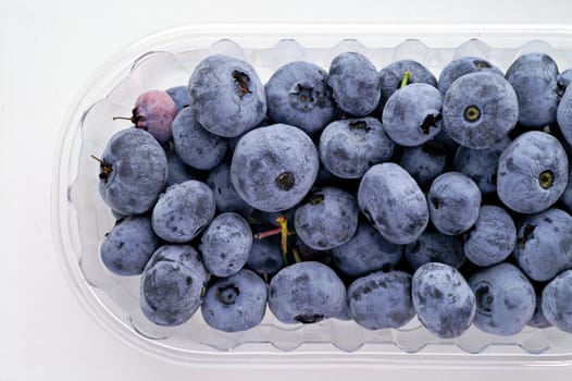 Wild berries: blueberries in a glass bowl