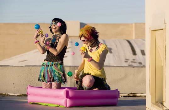 Punk Girls Juggling Plastic Balls on a Rooftop