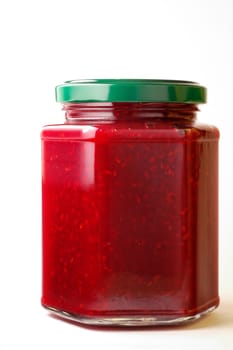 Raspberry jam in hexagonal jar (1) with clipping path