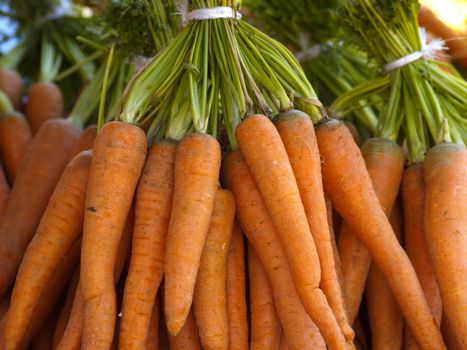 bunch of carrots on market stall