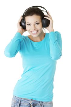 Beautiful woman with headphones, she is listen to the music