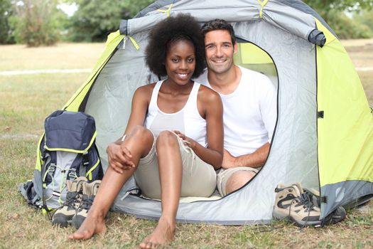 Couple camping in a tent