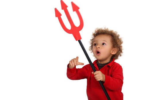 Young child holding up a devil's fork