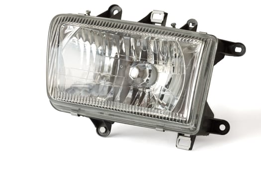 Automobile headlight on a white background