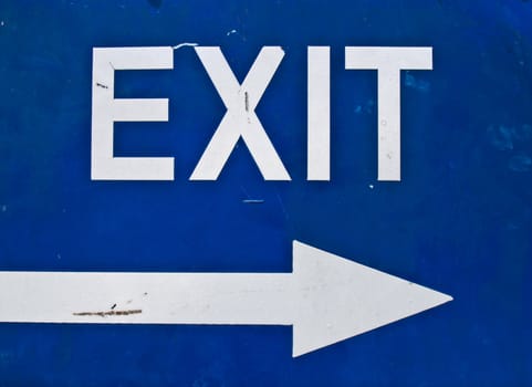 Blue exit road sign with arrow