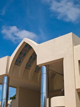 Pointed arch entrance hall of office building on blue sky