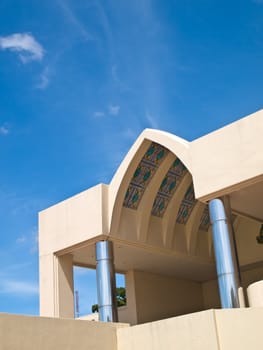 Pointed arch entrance hall of office building on blue sky