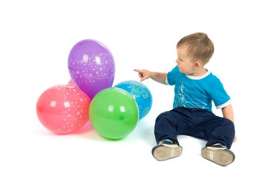 The boy counts balloons, a white background