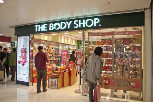 HONG KONG - DEC 22,  The Body Shop opens a shop in Tuen Mun, Hong Kong on 22 Decemeber, 2011. There are many people shopping there.