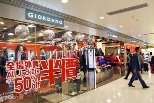 HONG KONG - DEC 22,  Giordano opens a shop in Tuen Mun, Hong Kong on 22 Decemeber, 2011. There are many people shopping there.