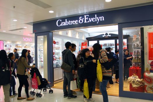 HONG KONG - DEC 22,  Crabtree and Evelyn opens a shop in Tuen Mun, Hong Kong on 22 Decemeber, 2011. There are many people shopping there.