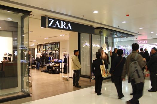 HONG KONG - DEC 22,  Zara opens a shop in Tuen Mun, Hong Kong on 22 Decemeber, 2011. There are many people shopping there.  