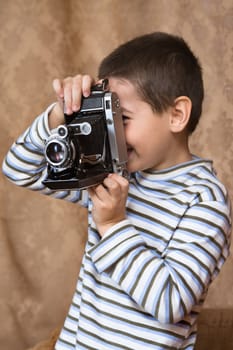 The boy and a retro camera