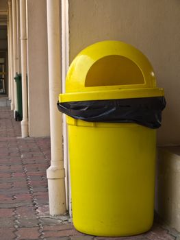 Yellow plastic bin
