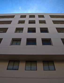 Facade windows of office building on blue sky