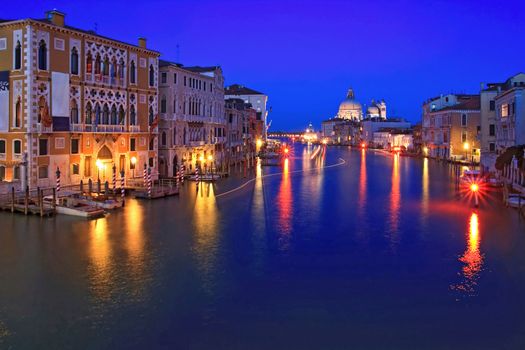 Santa Maria Della Salute, Church of Health, Grand canal Venice Italy with light trail of passenger cruise