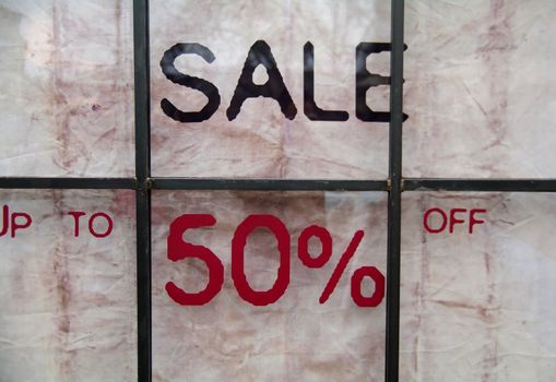 Sign informing about sales; up to 50% off