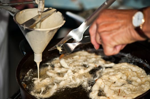 preparation of pancakes stuffed with jam and powdered sugar
