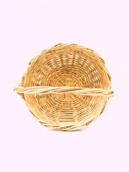 Empty wicker basket isolated on white