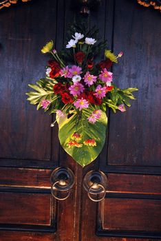 arrangement of flowers on the wall board